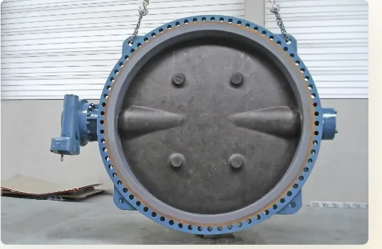 Large blue industrial valve prepared for lifting and inspection