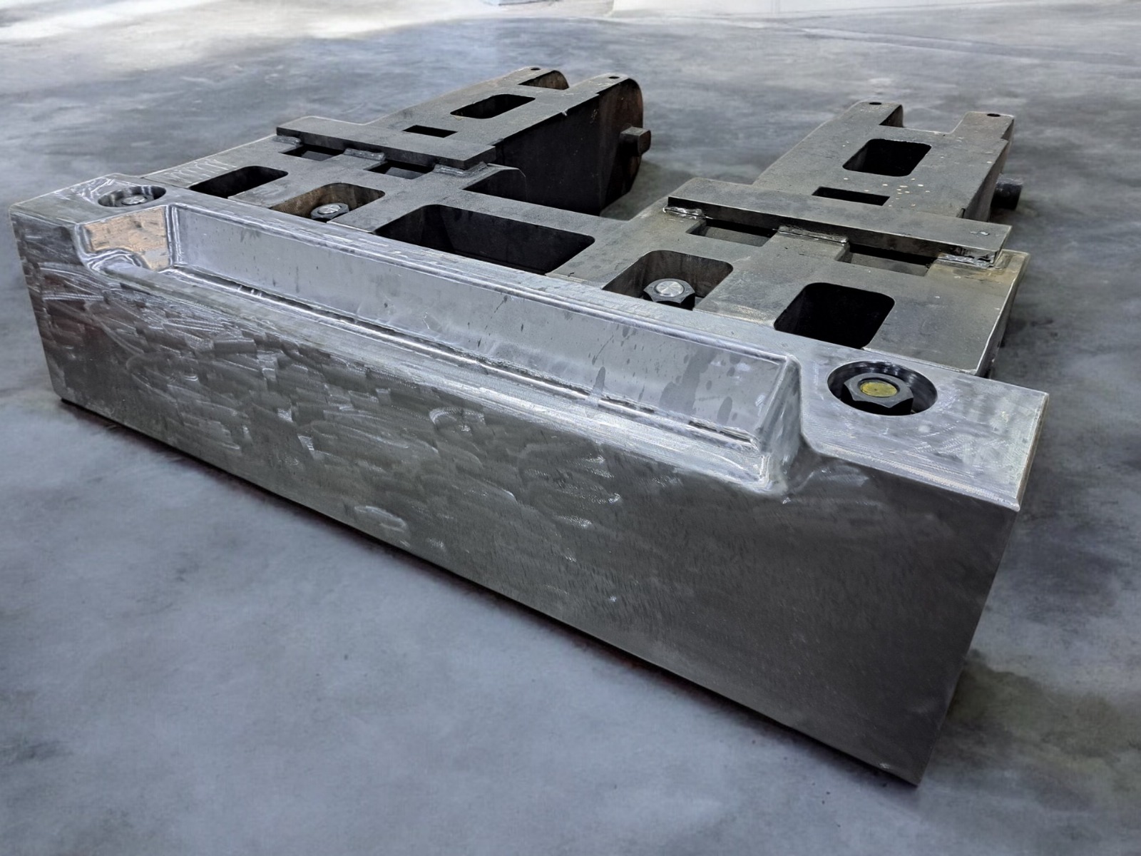 Fabricated industrial assembly with machined interfaces