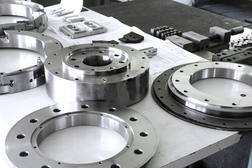 Finished machined rings and flanged components on an inspection table