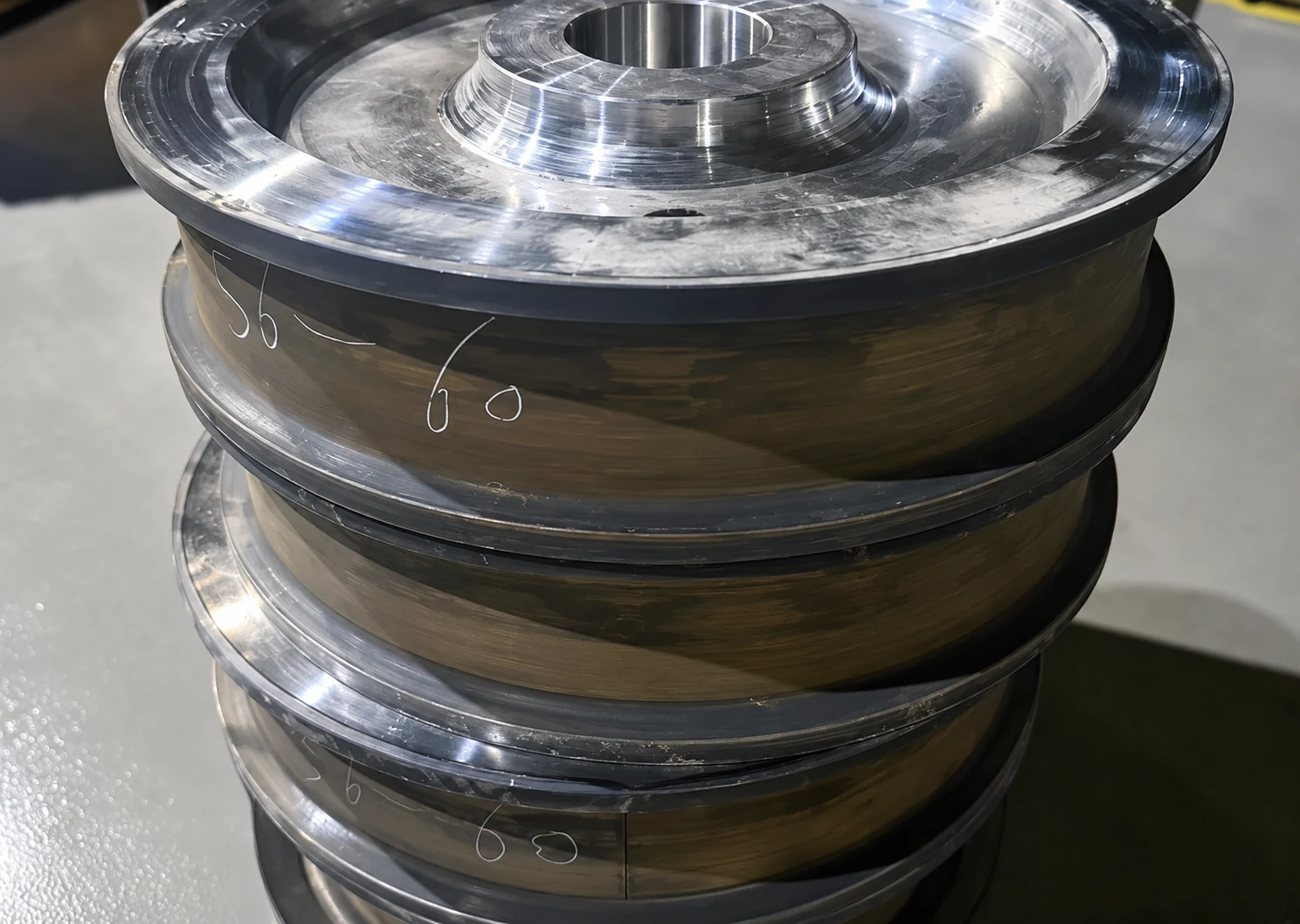 Close-up of machined crane wheel marked 56 to 60 HRC