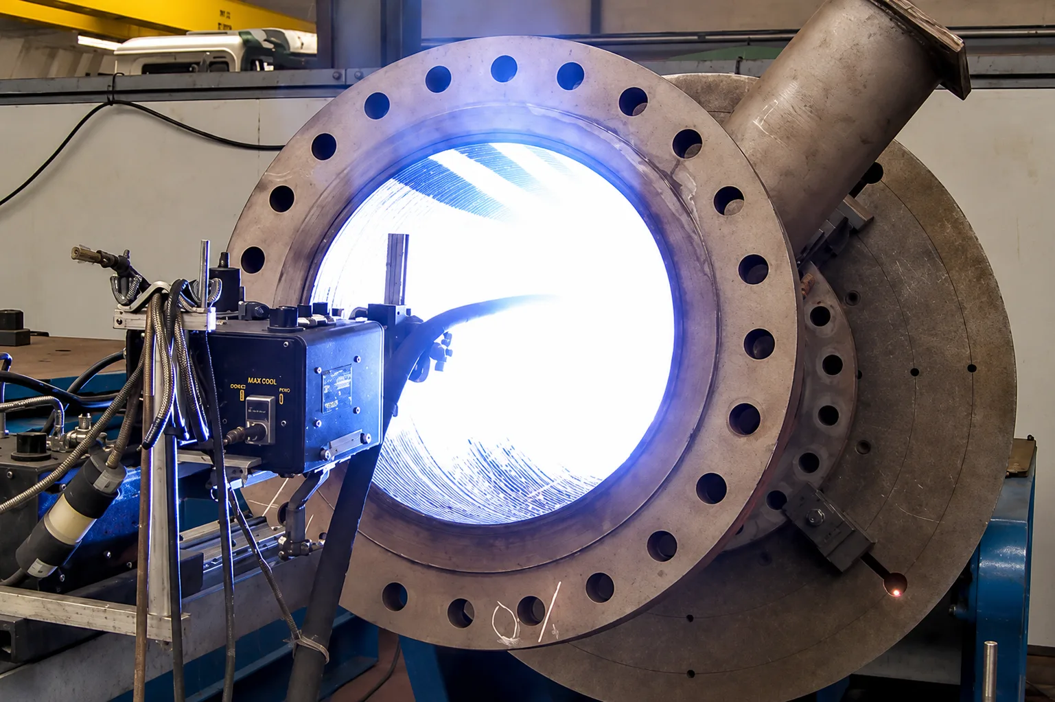 Internal hard-facing or cladding operation inside a large flanged cylindrical component