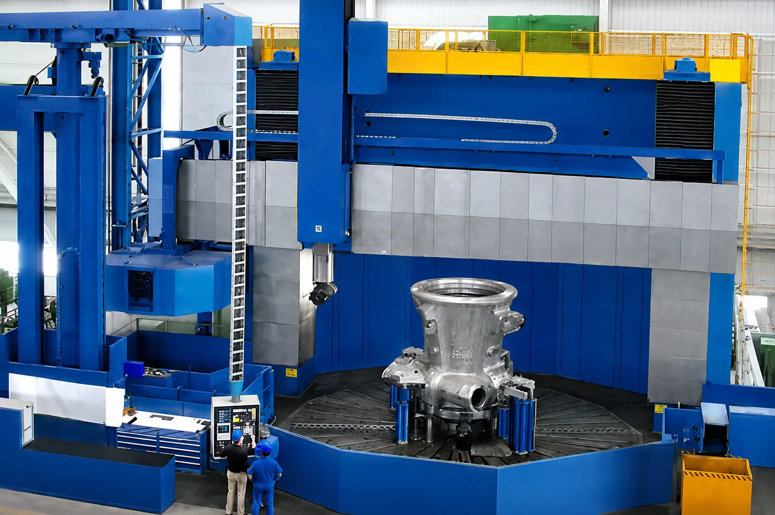 Blue vertical turning machine machining a large metallic component