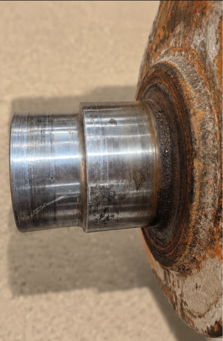Worn rolling mill roll journal before reconditioning